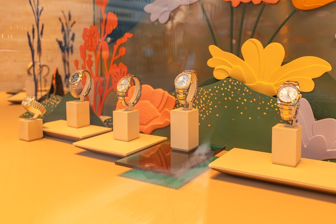 Luxury Swiss mechanical wristwatch displayed on a velvet cushion in a boutique showcase
