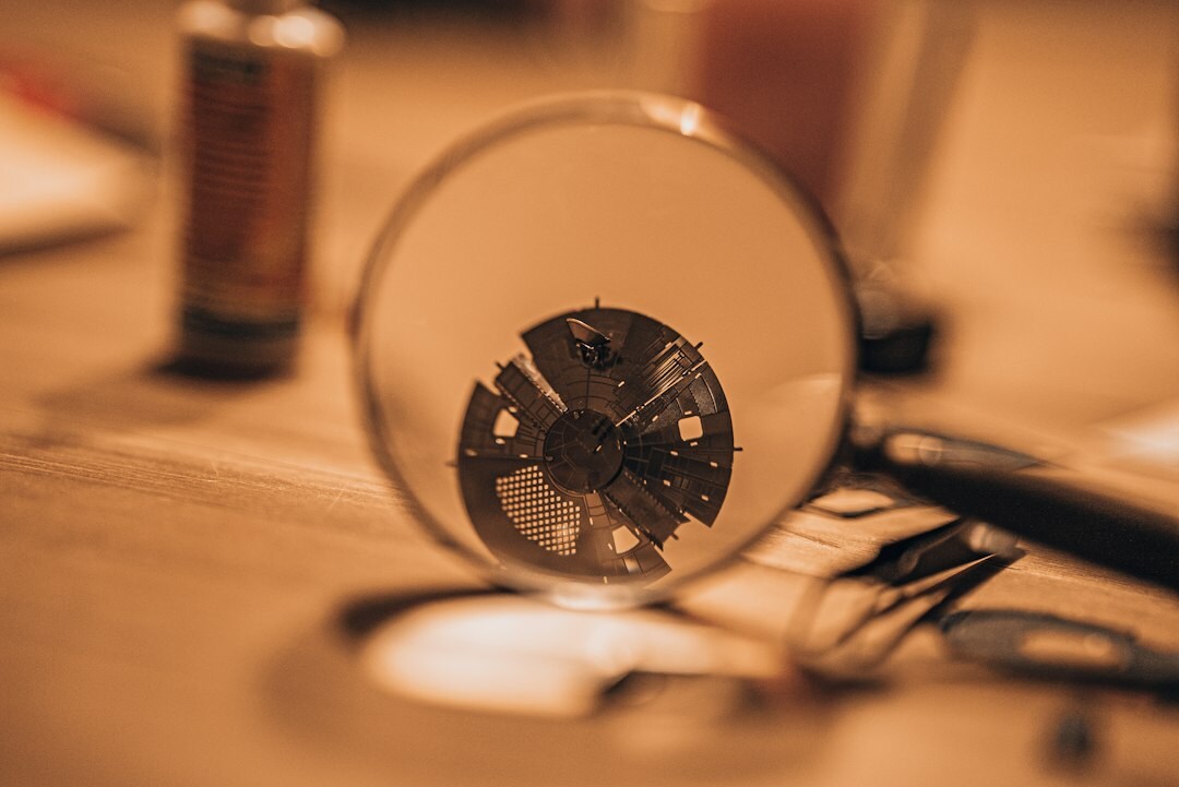 Swiss watchmaker's hands assembling a fine mechanical movement under a loupe